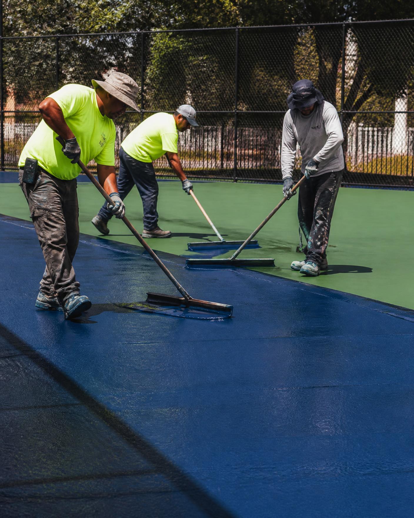 GritPlex crew applying an acrylic sports court surface